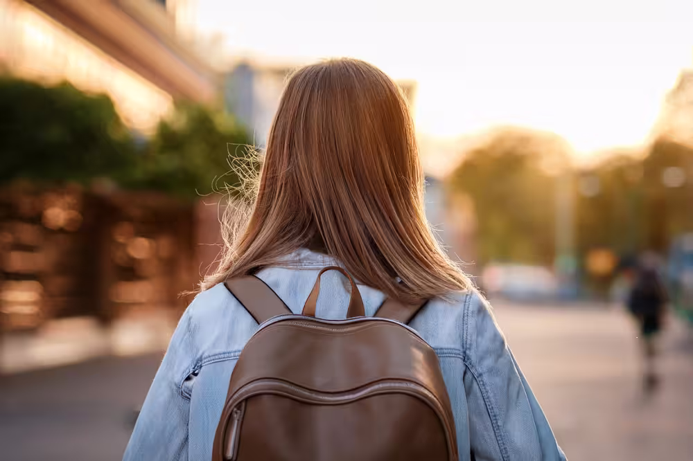 teen with backpack going back to school